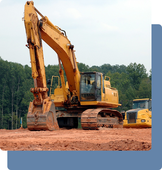 Yellow excavator on a construction site with dirt ground.