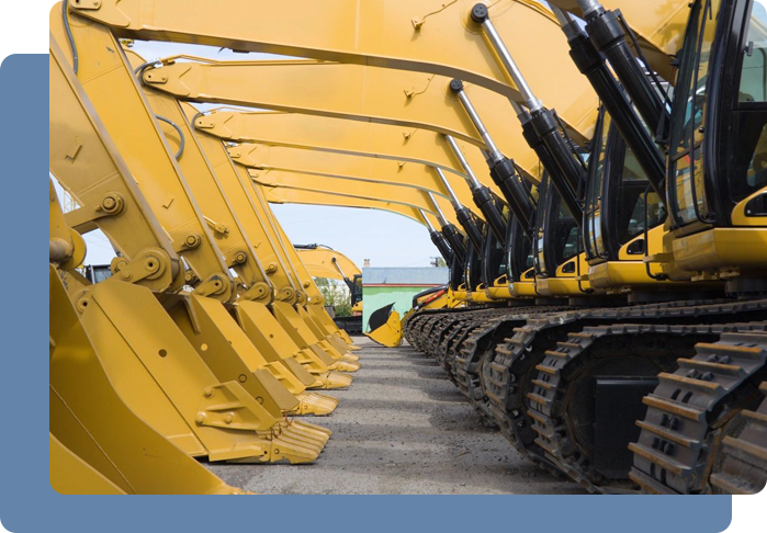 Row of yellow excavators with extended arms, parked side by side.